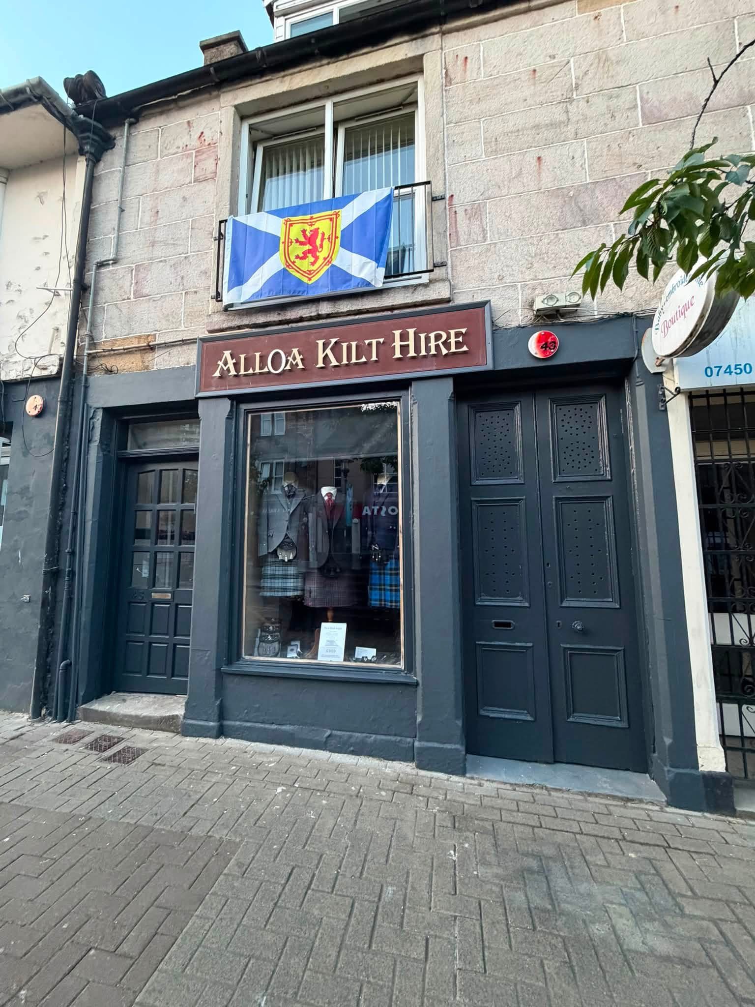 Exterior painting by DJM Decor at Alloa Kilt Hire, showing the dark painted shopfront, window frame and doors